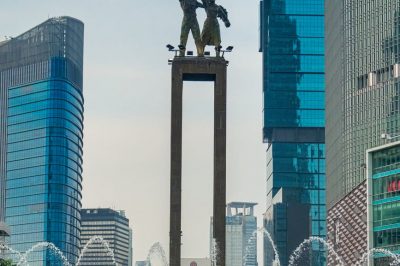 photo of people standing near water fountain